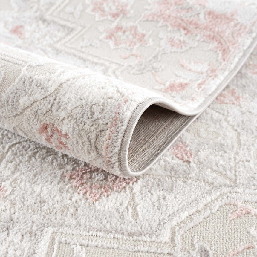 Close-up of the Calum Pink Floral Thick Area Rug showing its plush texture and traditional floral pattern. Fold