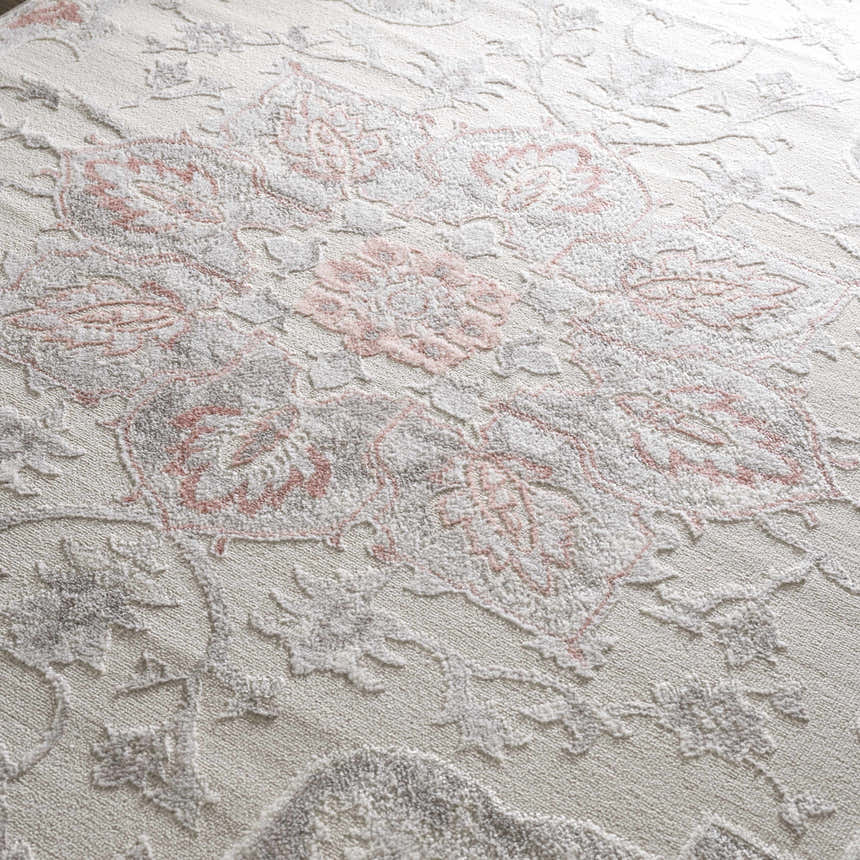 Close-up of the Calum Pink Floral Area Rug showing its texture and gray and pink traditional floral design. Texture