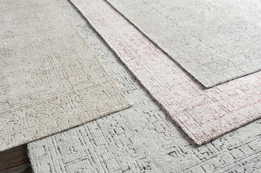 Close-up of the Cunderdin Carpet showing its hand-knotted texture and farmhouse-style pattern in mauve and white viscose. Styleshot