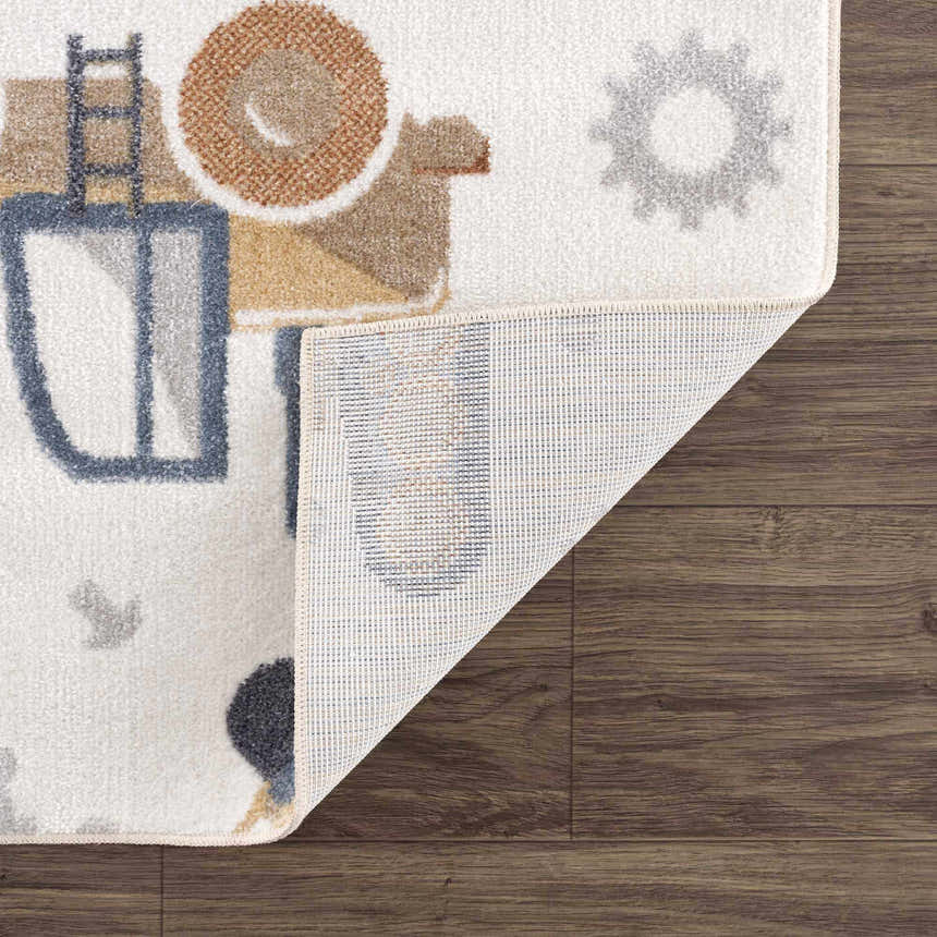 Close-up of Construction Washable Kids Area Rug showing blue, brown, cream, and yellow construction vehicle design. Fold