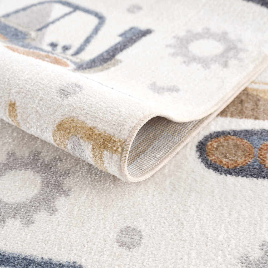 Close-up of the Construction Washable Kids Area Rug featuring blue, brown, and yellow construction vehicle designs. Fold