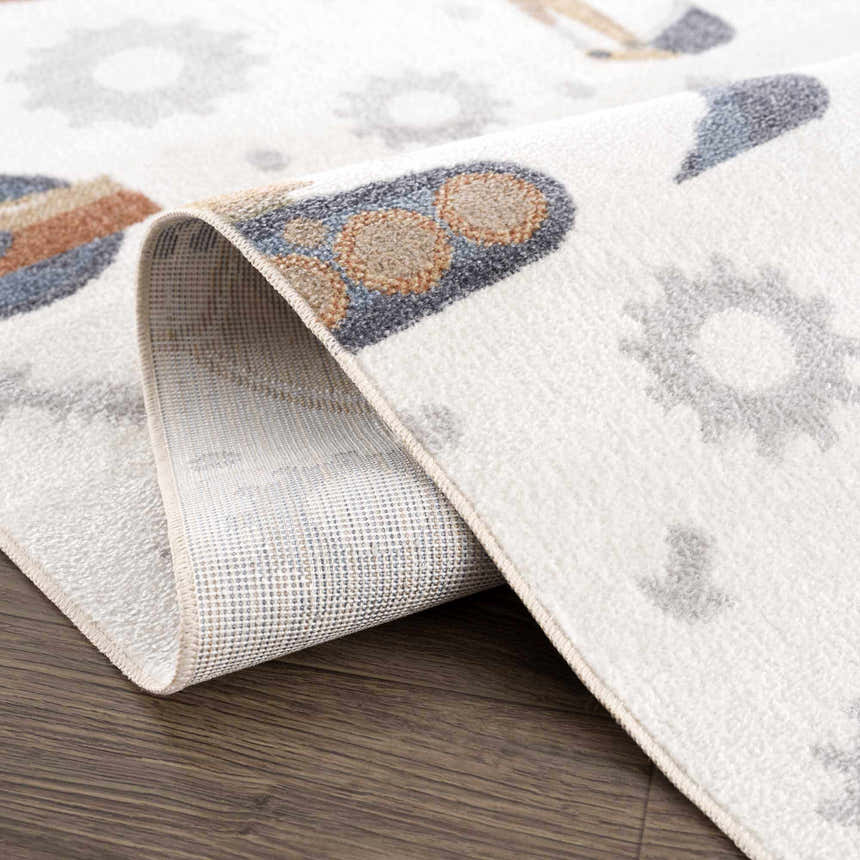 Close-up of the Construction Washable Kids Area Rug showing the excavator and gear pattern in blue, brown, cream, and yellow. Fold