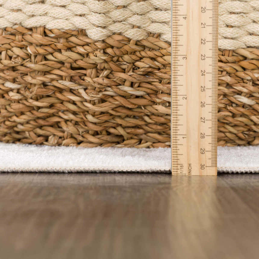 Close-up of the Construction Washable Kids Area Rug showing woven brown and cream texture with a ruler for scale. Pile