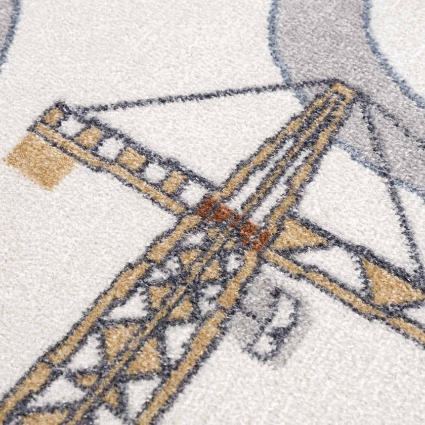 Close up of the Olwen Washable Area Rug showing a crane design in cream, light gray, and blue. Texture