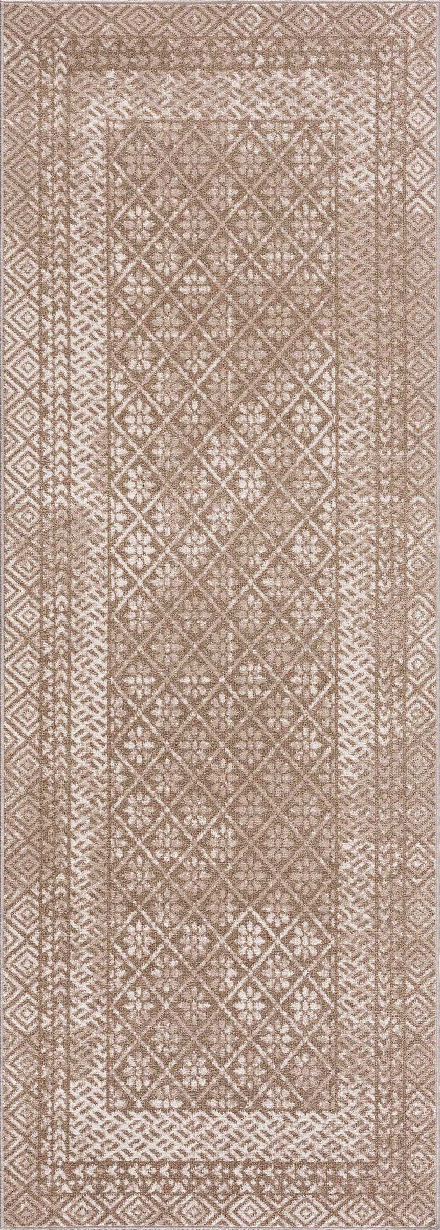 Close-up of Caditaan Washable Area Rug. Brown, cream, and light beige rug with a traditional diamond and floral pattern. Design-Runner-2773