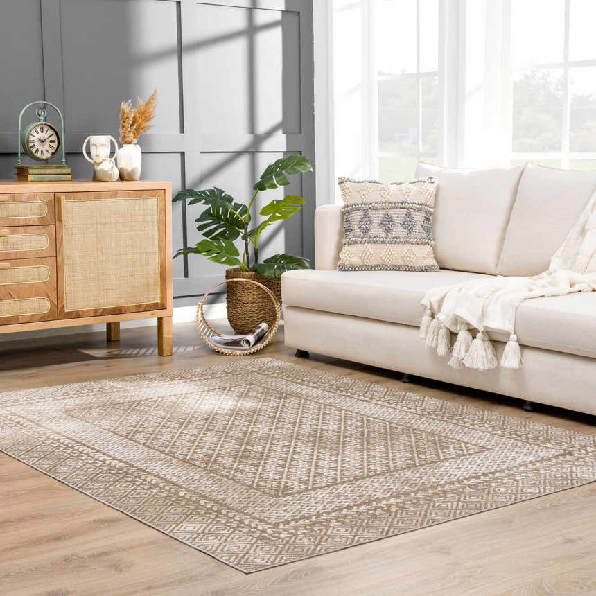Living room scene with a cream sofa and the brown Caditaan Washable Area Rug, creating a warm, inviting farmhouse style. Roomscene-Rectangle