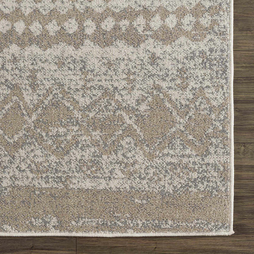 Close-up of Tupsan Washable Area Rug showing cream, light beige, and light gray contemporary pattern and machine woven texture. Swatch