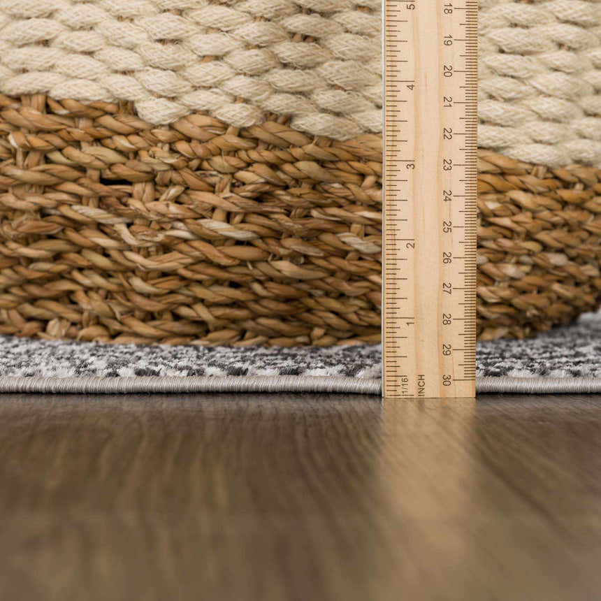 Close-up of the Coledale Black & White Washable Rug showing the rug's texture, pile height, and edge binding. Pile