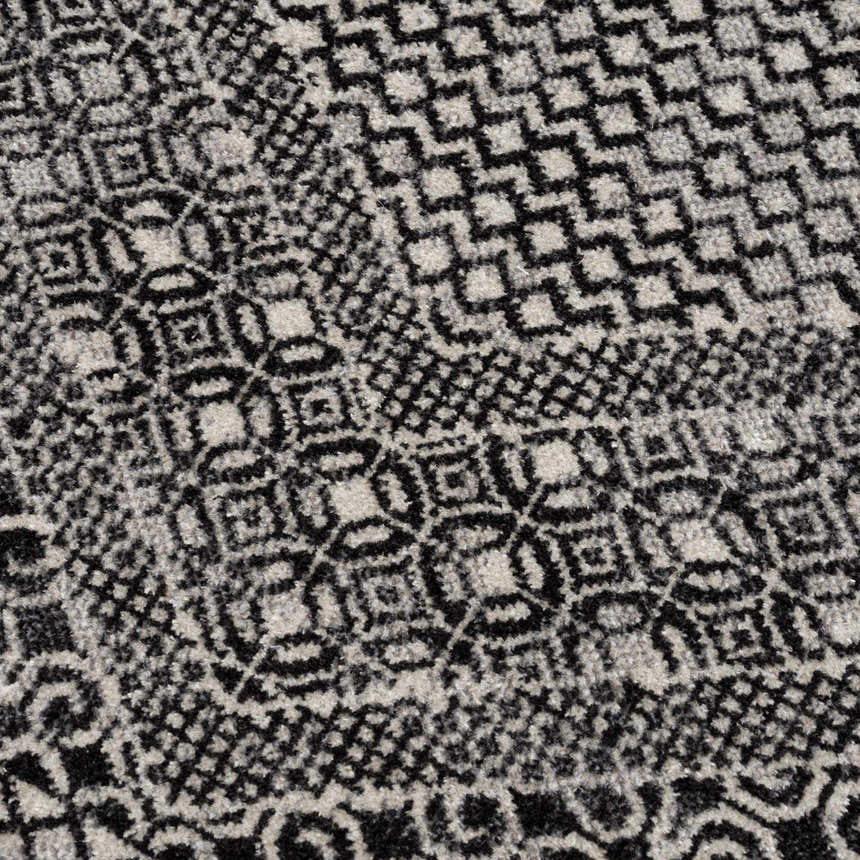 Close-up of the Coledale Black & White Washable Rug, showcasing its geometric pattern and soft texture. Texture