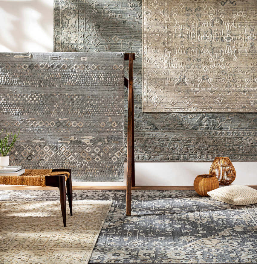 Styled room scene with multiple Macgregor Area Rugs in charcoal, gray, and olive, showcasing their bohemian and farmhouse designs. Styleshot