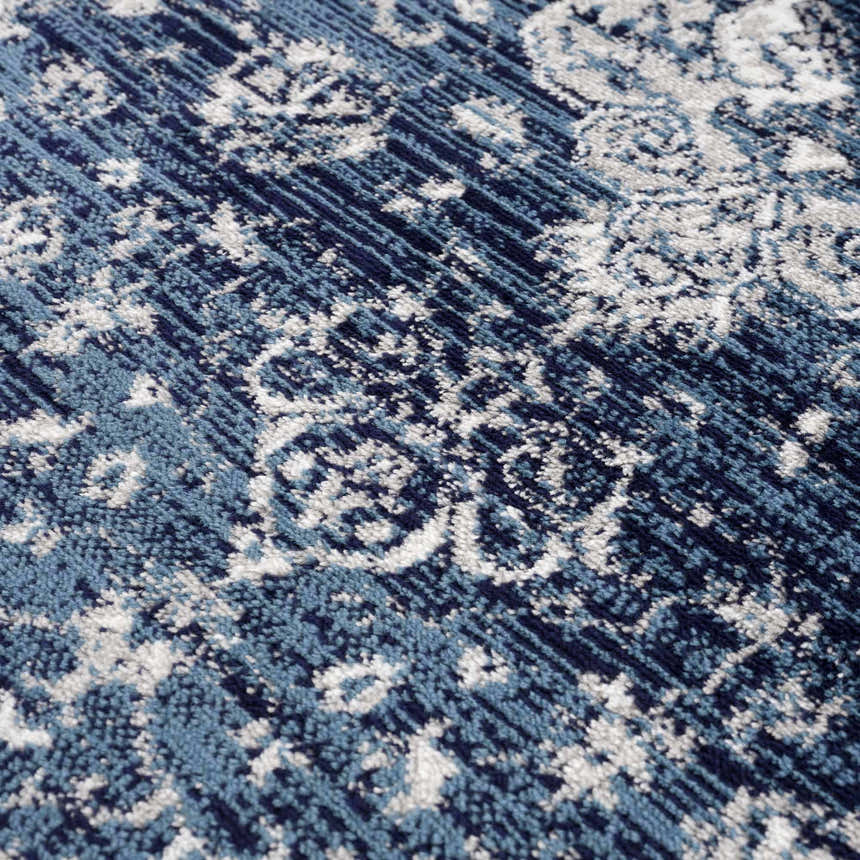 Close-up of the Billy Area Rug in blue and navy, featuring a traditional Persian-inspired pattern. Texture