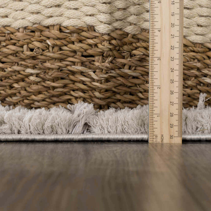 Close-up of the silver gray Andia Gray Area Rug showing shag texture and pile height with ruler. Pile