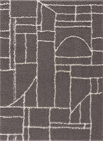 Close-up of Andia Charcoal Area Rug. Gray shag rug with a geometric white line pattern. Urban modern style. Design-Rectangle-46