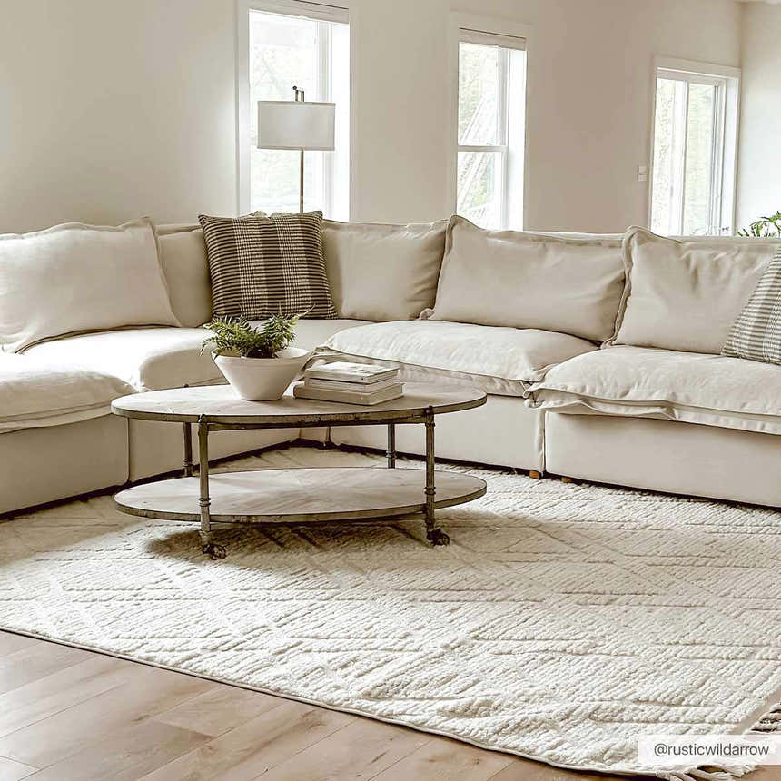 Neutral living room with a bone-colored sectional and the Maduao Area Rug, creating a cozy, inviting space. Roomscene-Rectangle