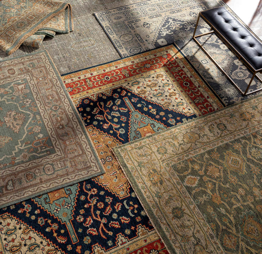 Close-up of hand-knotted Clunes Area Rugs in black, brown, green, beige, and yellow, showcasing traditional and oriental designs. Styleshot