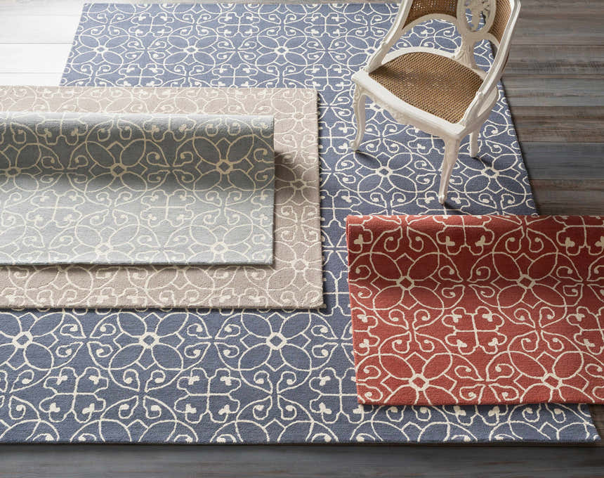 Davie Area Rug in ivory, slate blue, and terracotta with a floral pattern. Hand-tufted wool runner rug. Styleshot