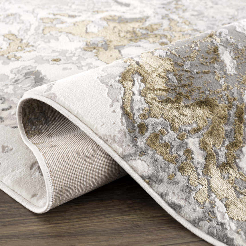 Close-up of the Kaleo Gray & Green Marble Area Rug showing its abstract pattern, texture, and backing. Fold