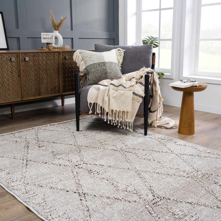 Cozy mudroom scene with gray walls, wood accents, and a Nyla Bone Indoor Outdoor Rug. Roomscene-Rectangle