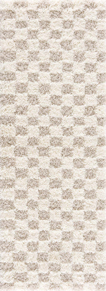 Close-up of the Atira Light Brown Checkered Area Rug. Cream and light brown shag rug with a geometric checkered pattern. Design-Runner-2773