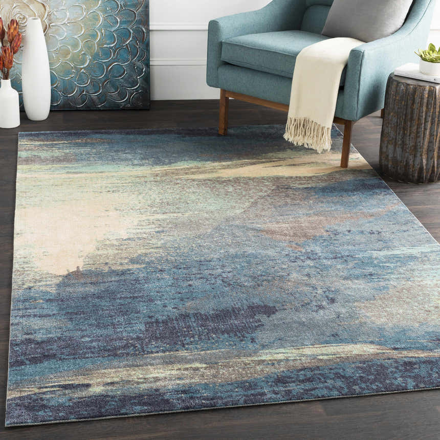 Living room scene with a blue chair and Alvaton Abstract Blue Rug in blue, denim, gray, and beige tones. Roomscene-Rectangle