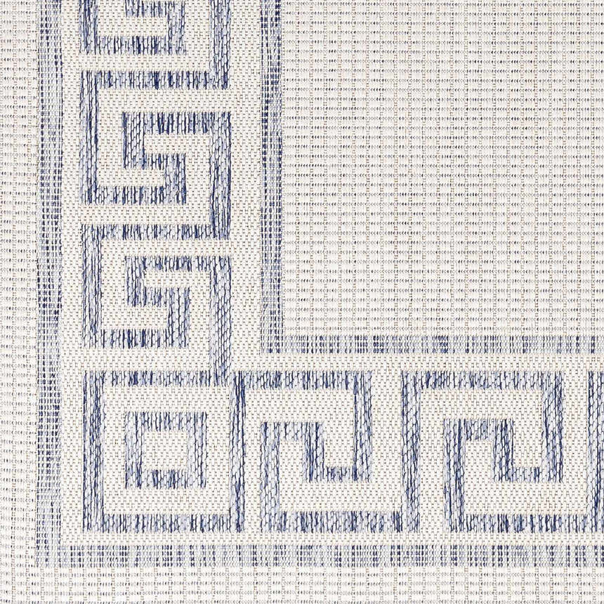 Close-up of Alen Cream & Blue Indoor Outdoor Rug showing Greek key design, woven texture, and neutral cream background. Swatch