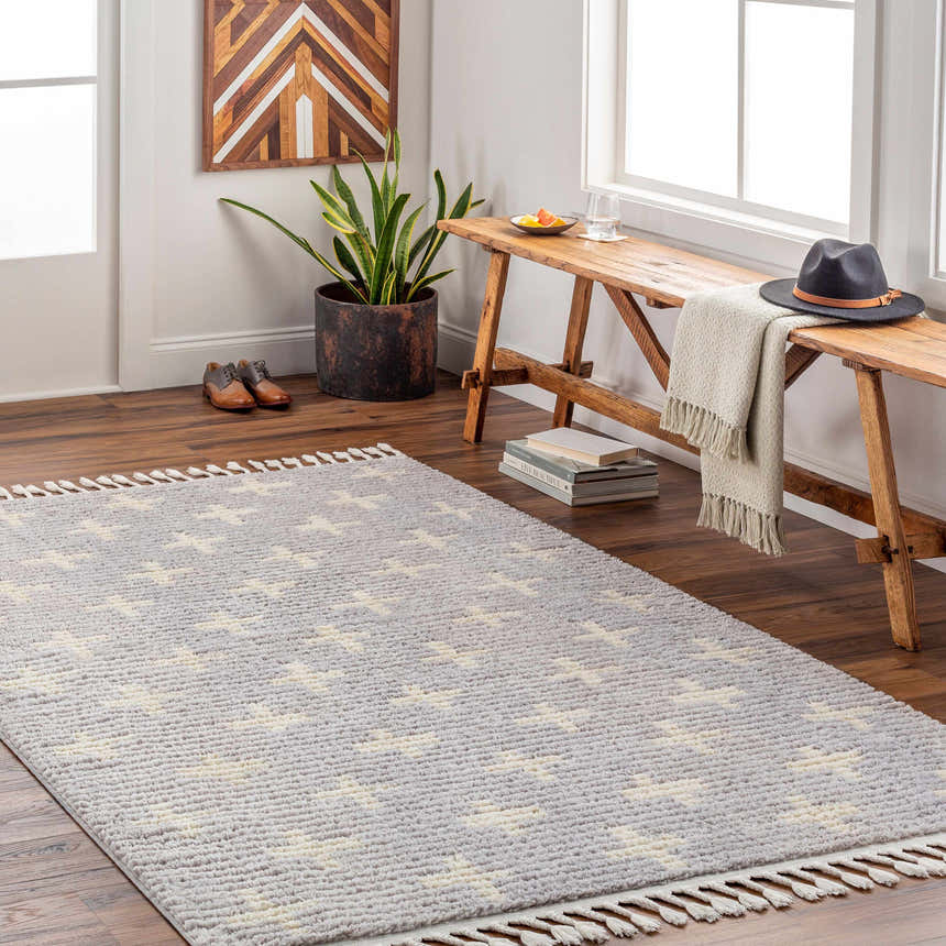 Entryway scene with ivory and gray Anda Area Rug, wood bench, and decor. Roomscene-Rectangle