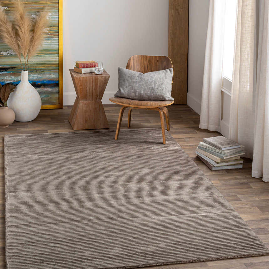 Neutral room scene with charcoal Angie Area Rug, wood chair, side table, and art. Roomscene-Rectangle