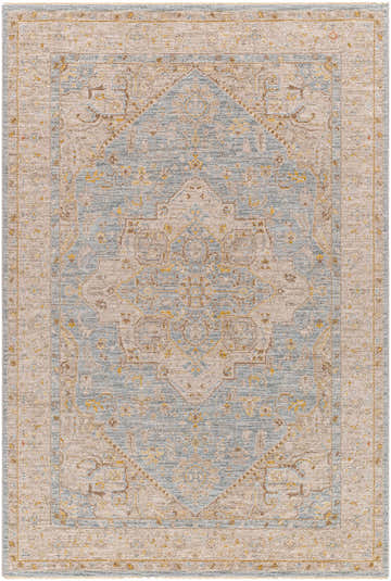 Close-up of the Arjun Thick Luxe Area Rug, featuring a traditional amber, taupe, and light blue geometric pattern. Design-Rectangle-575