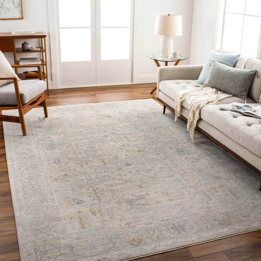 Living room with gray sofa and Ayarn Thick Luxe Statement Rug in brown, teal, and sage. Roomscene-Rectangle