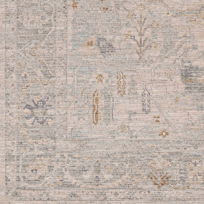Close-up of Ayarn Thick Luxe Statement Rug. Machine-woven polyester rug in brown, teal, sage, and gray with traditional patterns. Swatch
