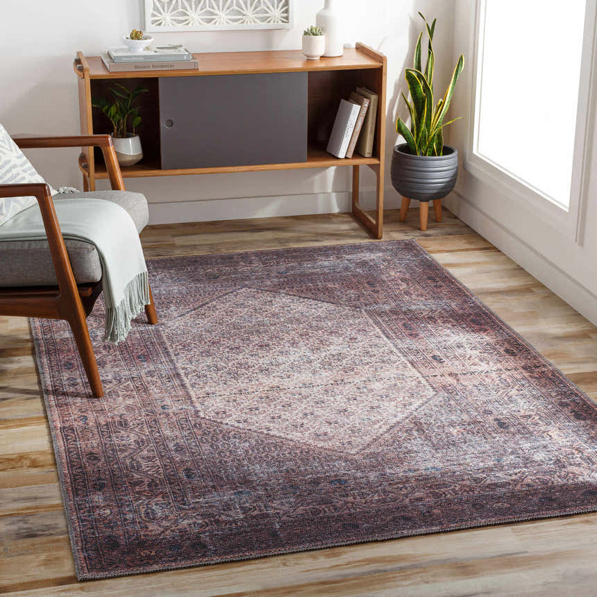 Living room with a Dusty Pink Bagacay Distressed Washable Area Rug, wood floors, mid-century modern chair and console table. Roomscene-Rectangle