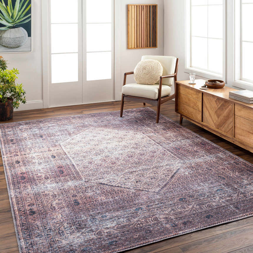 Living room scene with Dusty Pink Bagacay rug, cream chair, and wood cabinet on dark wood floors. Roomscene-Rectangle