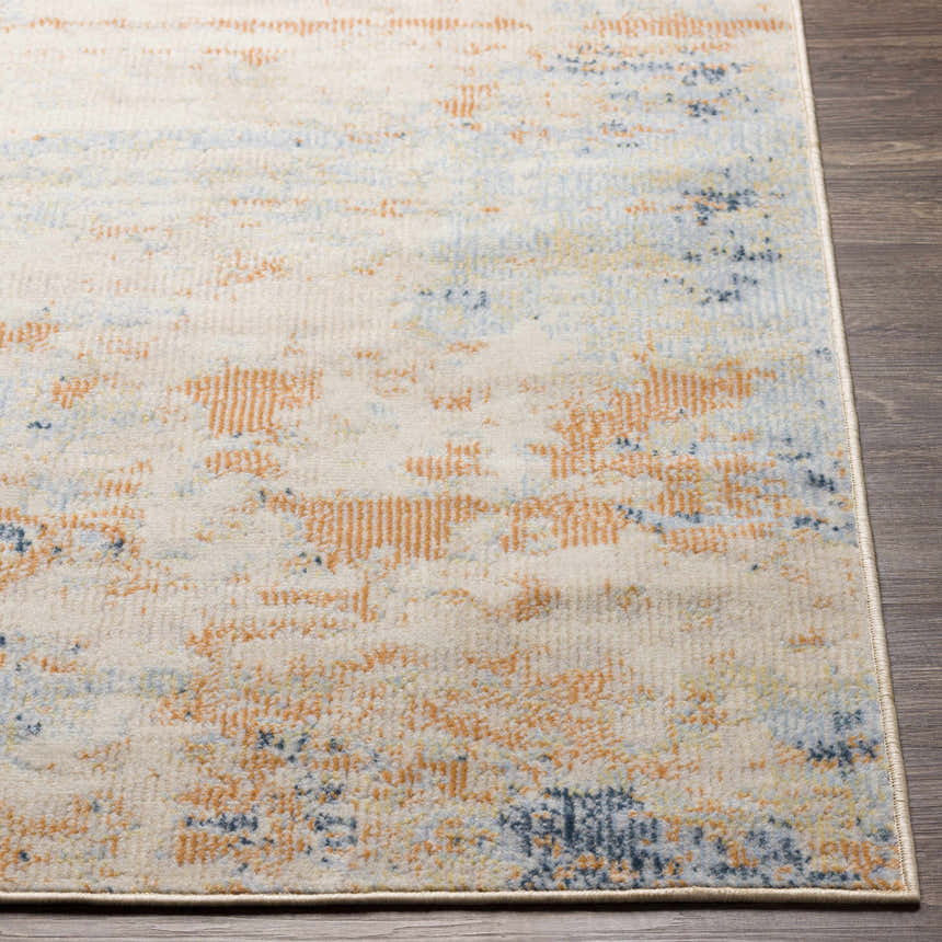 Close up of the Bagulin Area Rug showing its contemporary orange, blue, and ivory pattern. Front
