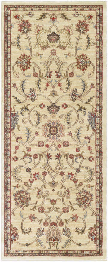 Close-up of the Bajadero Oushak Rug. Beige rug with a traditional floral pattern in coral, brown, and gray tones. Design-Runner