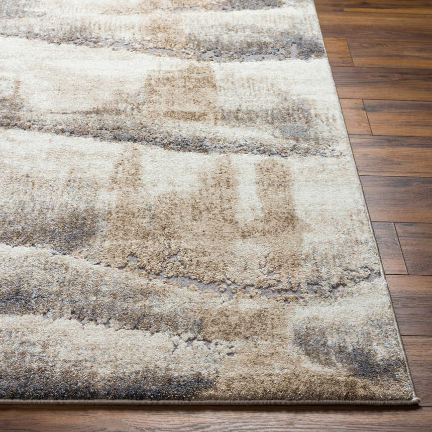 Close-up of the Banji Abstract Waves Area Rug. Beige, brown, and gray abstract pattern. Machine woven texture. Front