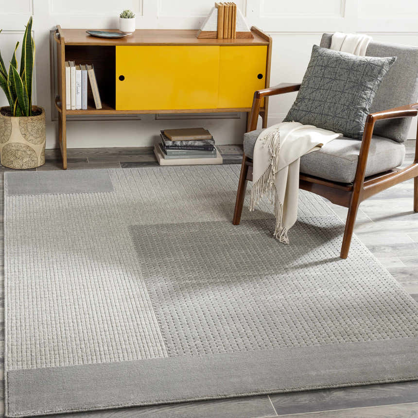 Mid-century modern living room with gray Bantiqui Area Rug, yellow cabinet, and gray chair. Scandinavian style. Roomscene-Rectangle