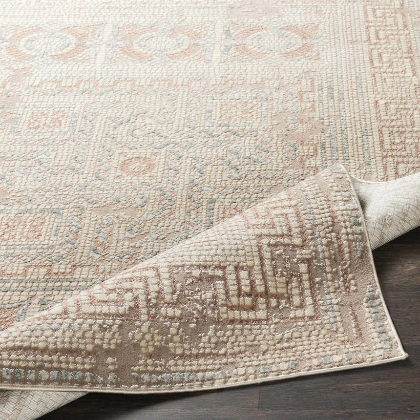 Close-up of the Terlingua Blush Greek Mosaic Carpet, showing its textured weave and geometric pattern in blush, tan, and slate. Fold