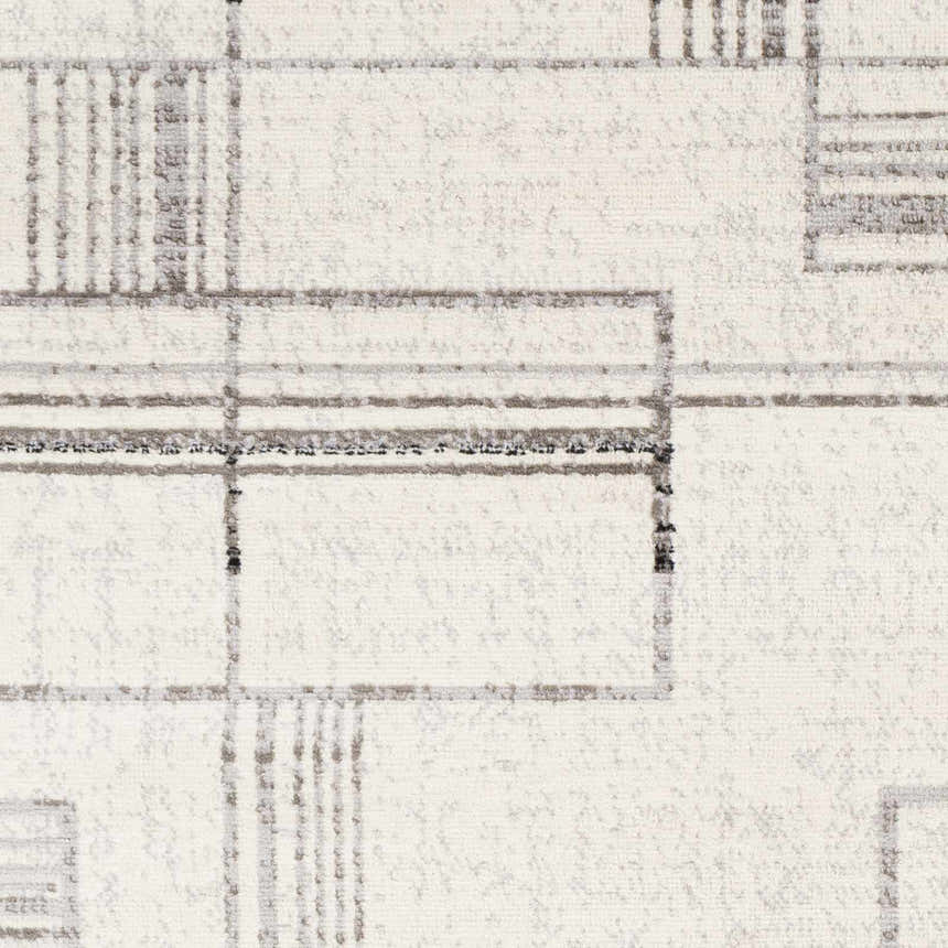 Close-up of the Bidwill Area Rug showing a geometric pattern in shades of gray on a white background. Swatch