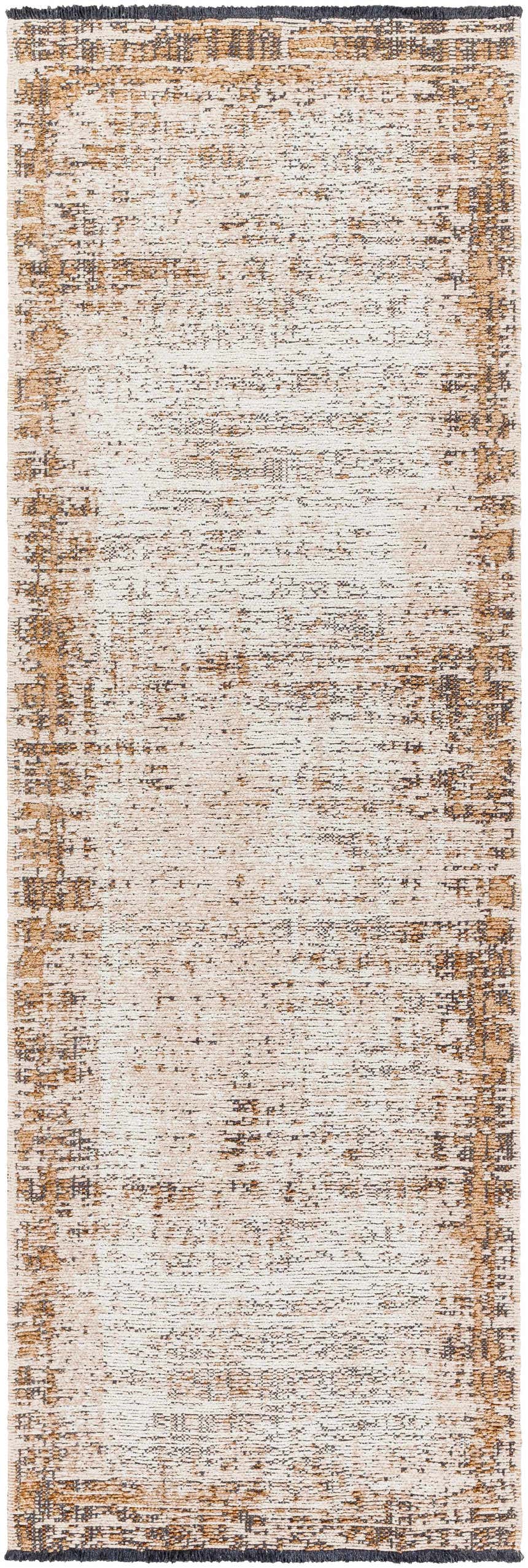 Close-up of the Binh Rustic Brown Rug with fringes. Tan, cream, and charcoal colors with a distressed, textured design. Design-Runner