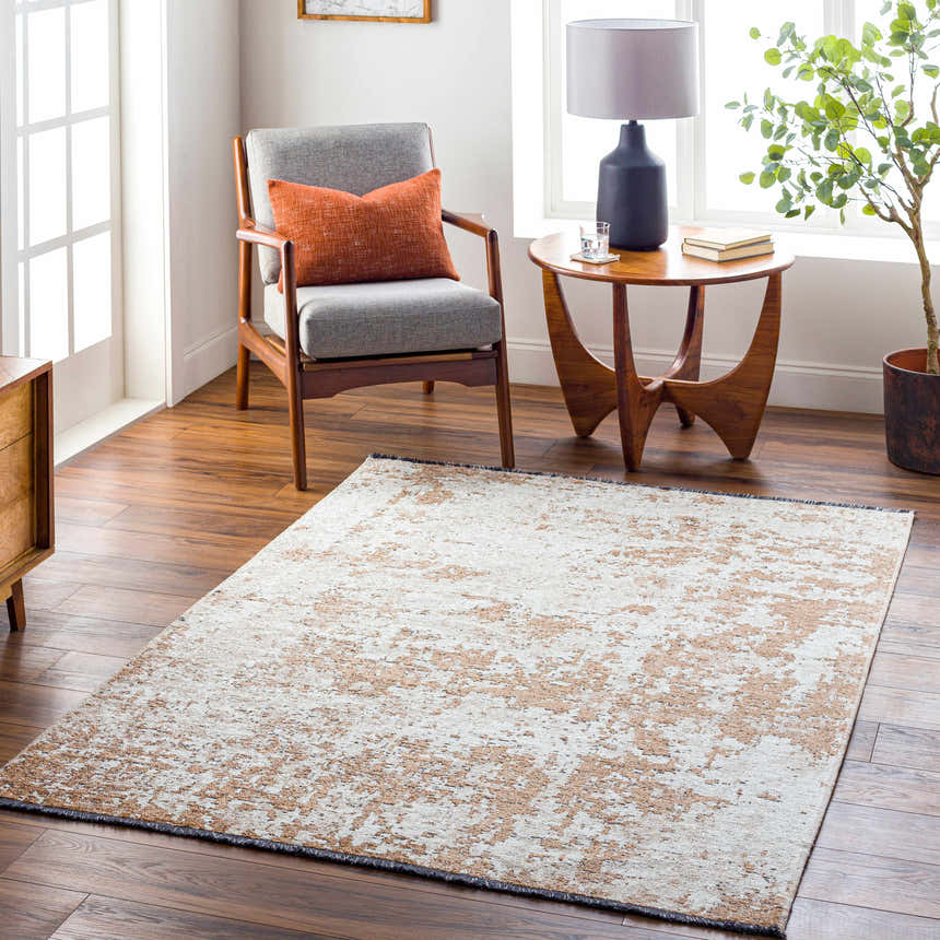 Living room scene with a Binh Rustic Brown Rug, gray chair, and wood accents. Roomscene-Rectangle