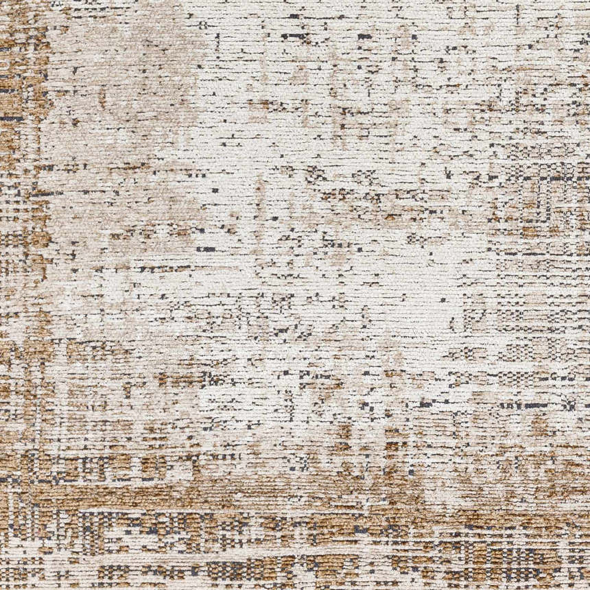 Close-up of the Binh Rustic Brown Rug. Features a distressed pattern in charcoal, cream, and tan. Farmhouse style. Swatch