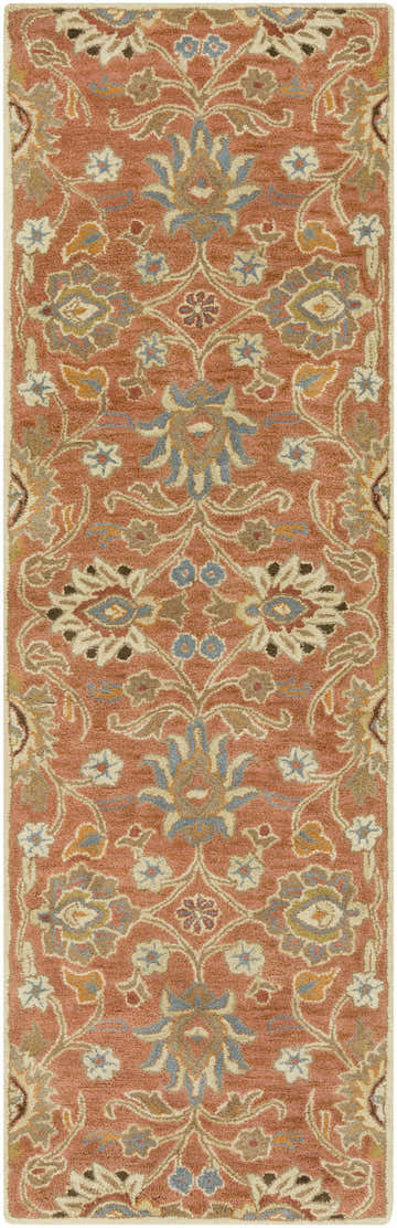 Close-up of the Conesus 1112 rug. Hand-tufted wool rug in brick red with bohemian floral pattern in beige, brown, and blue. Design-Runner-268