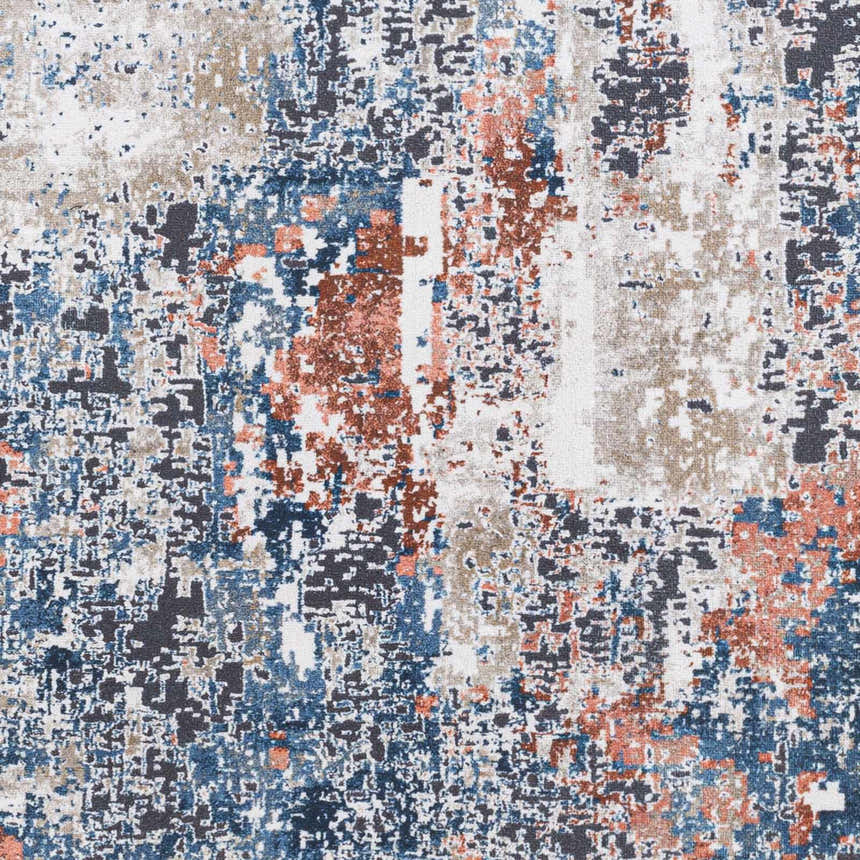 Close-up of Ballyshannon Washable Area Rug. Contemporary design in dark gray, denim, nutmeg, and silver hues. Machine woven texture. Swatch