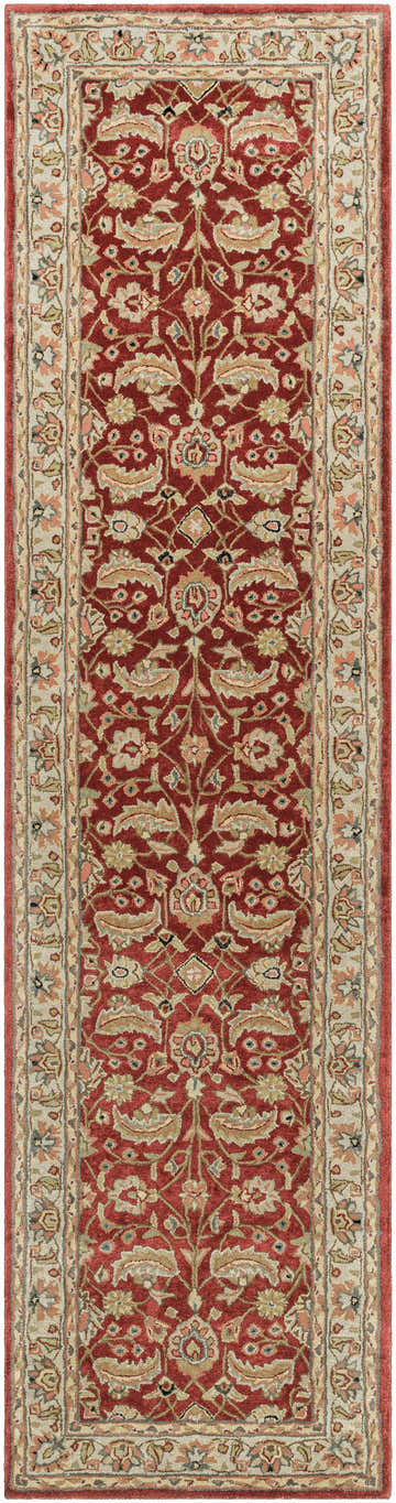 Close-up of the Brisbin Wool Area Rug. Features a traditional floral pattern in brick red, tan, and ivory. Hand-tufted texture. Design-Runner-312