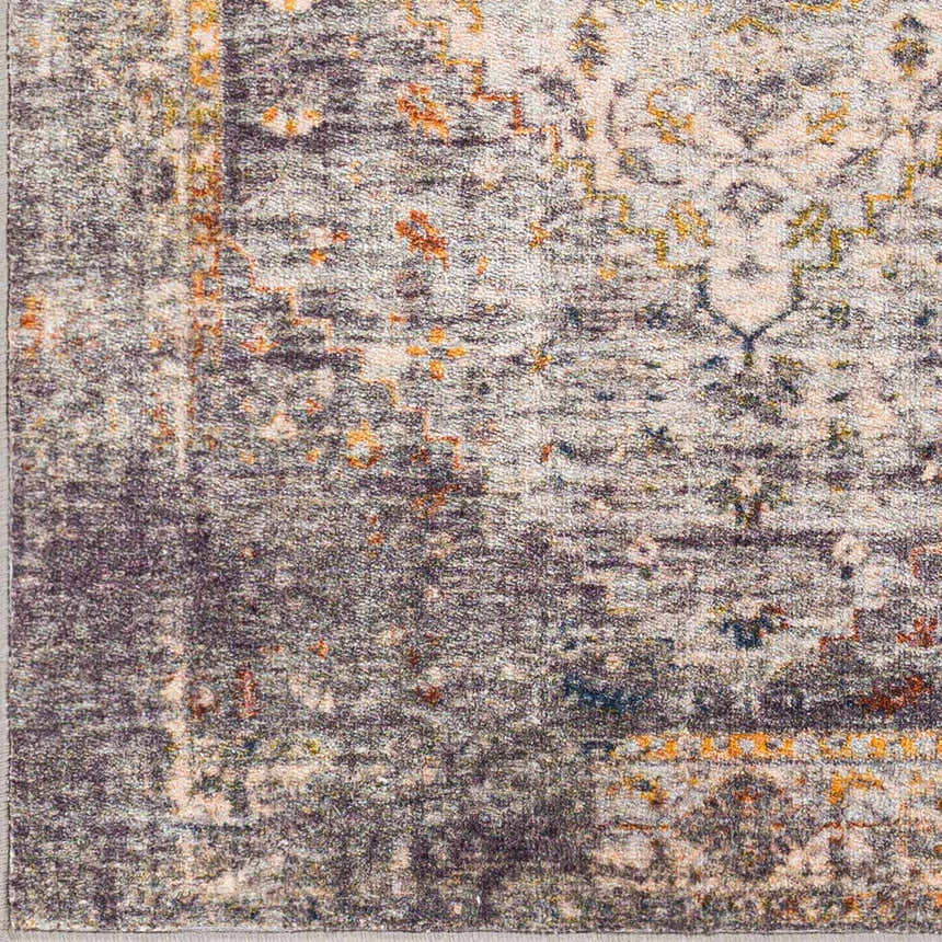 Close-up of Basiad Washable Area Rug showing traditional design, gray, oatmeal, mustard, and dark purple colors. Polyester texture. Swatch