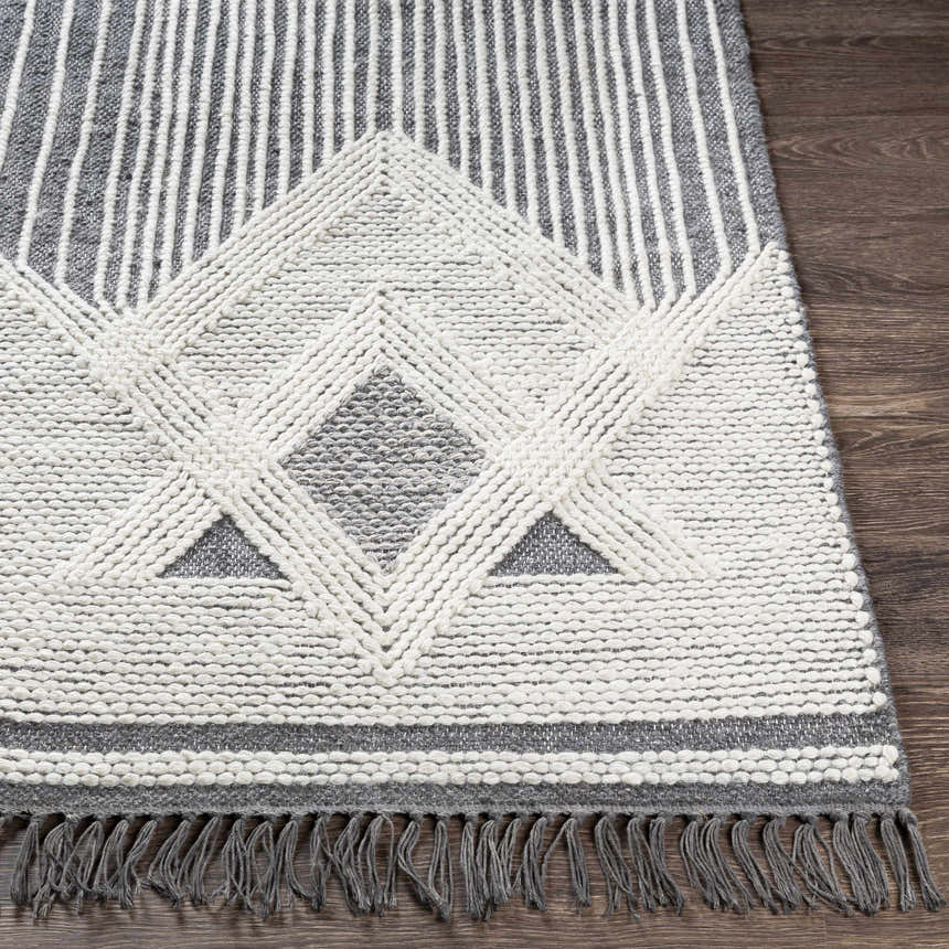 Close-up of Aldbourne Gray Tassel Flatweave Wool Rug showing geometric pattern and tassel fringe detail. Front