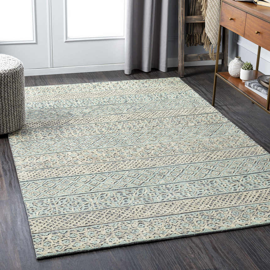 Living room scene with a beige and sage Byron Area Rug, wood floors, and modern farmhouse decor. Roomscene-Rectangle