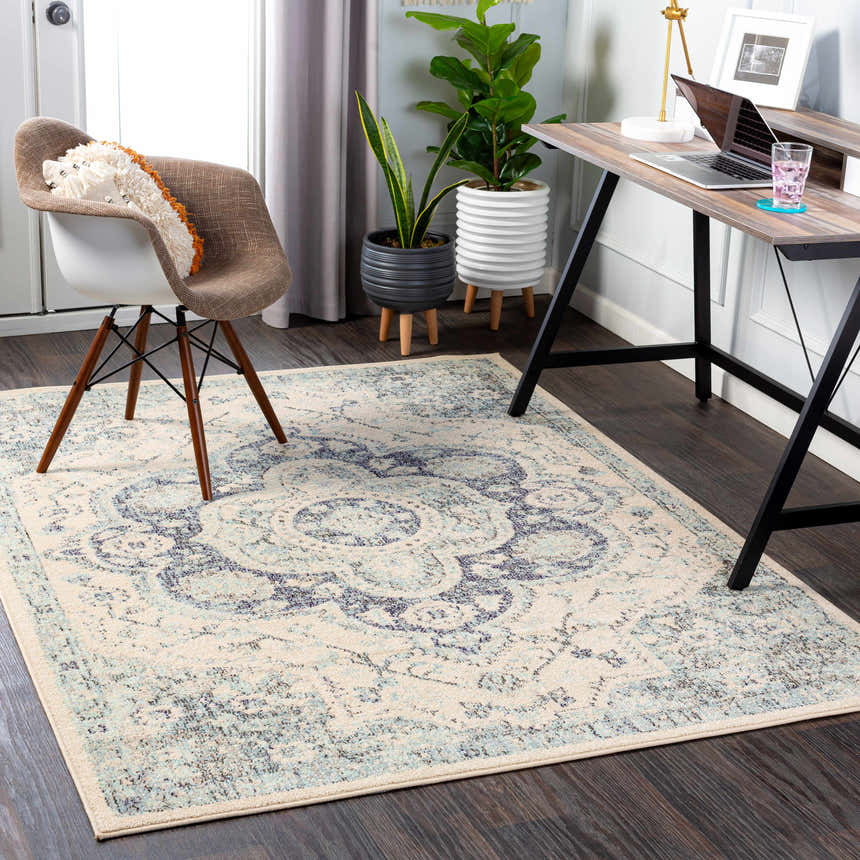 Home office with Calpine Area Carpet, wood desk, chair, and plants. Contemporary, oriental rug style. Roomscene-Rectangle