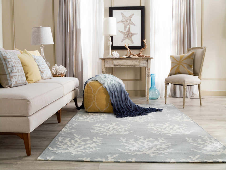 Coastal living room with Carversville Ice Blue Botanical Wool Rug, sofa, and beachy decor. Farmhouse style. Roomscene-Rectangle