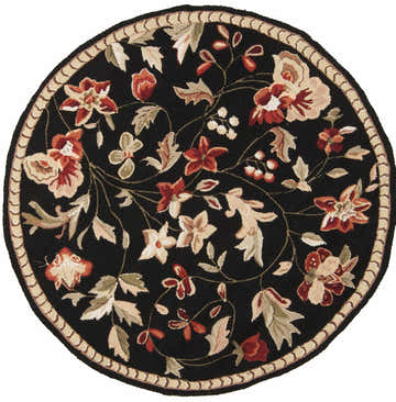 Close-up of round Casselton Area Rug. Black wool rug with rust, tan, and olive floral pattern and tan border. Design-Round